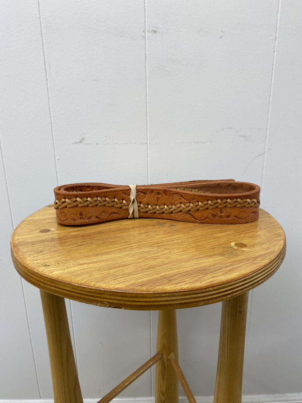 Vintage Brown Leather Belt on a table